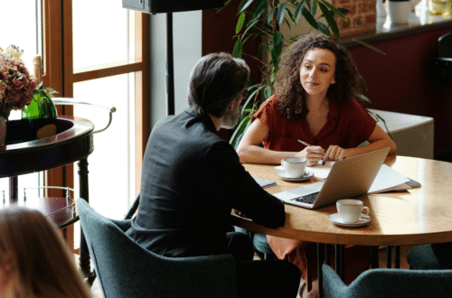 Man and woman on table in conversation