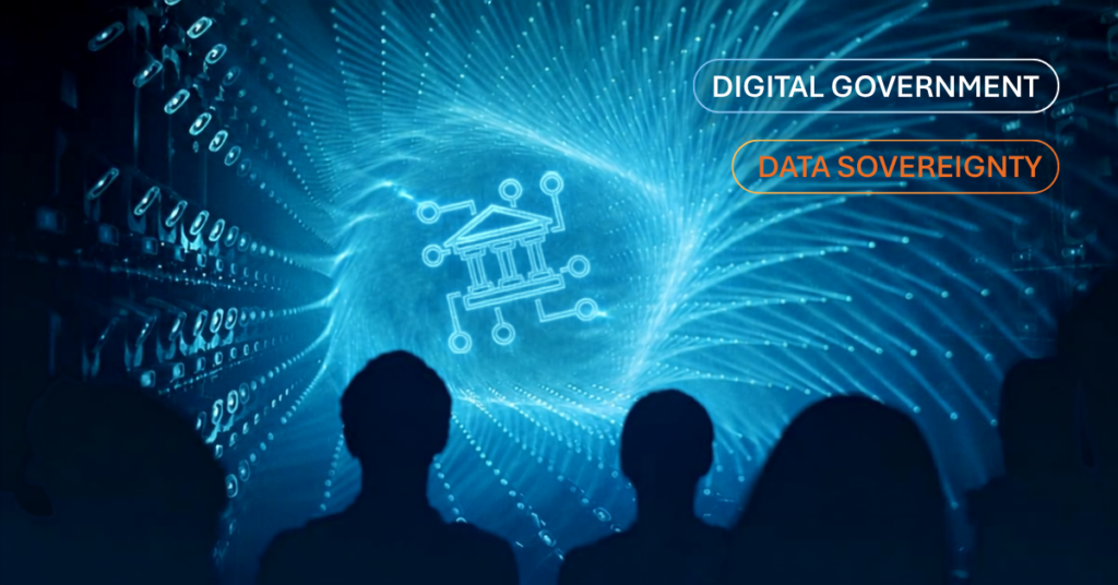 Silhouettes of an audience looking at a glowing digital government icon, labelled Digital Government and Data Sovereignty.